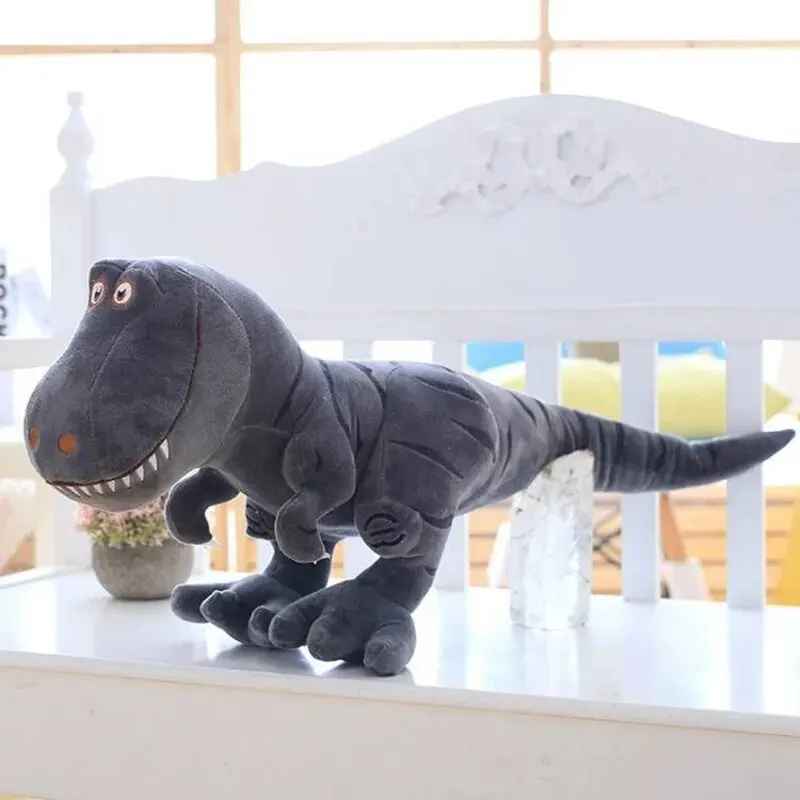 cadeau anniversaire peluche dinosaure gris banc blanc