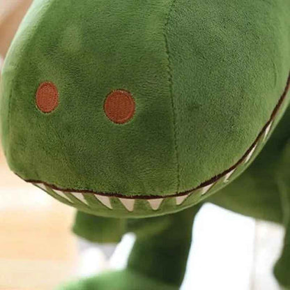 cadeau anniversaire peluche dinosaure vert museau gros plan