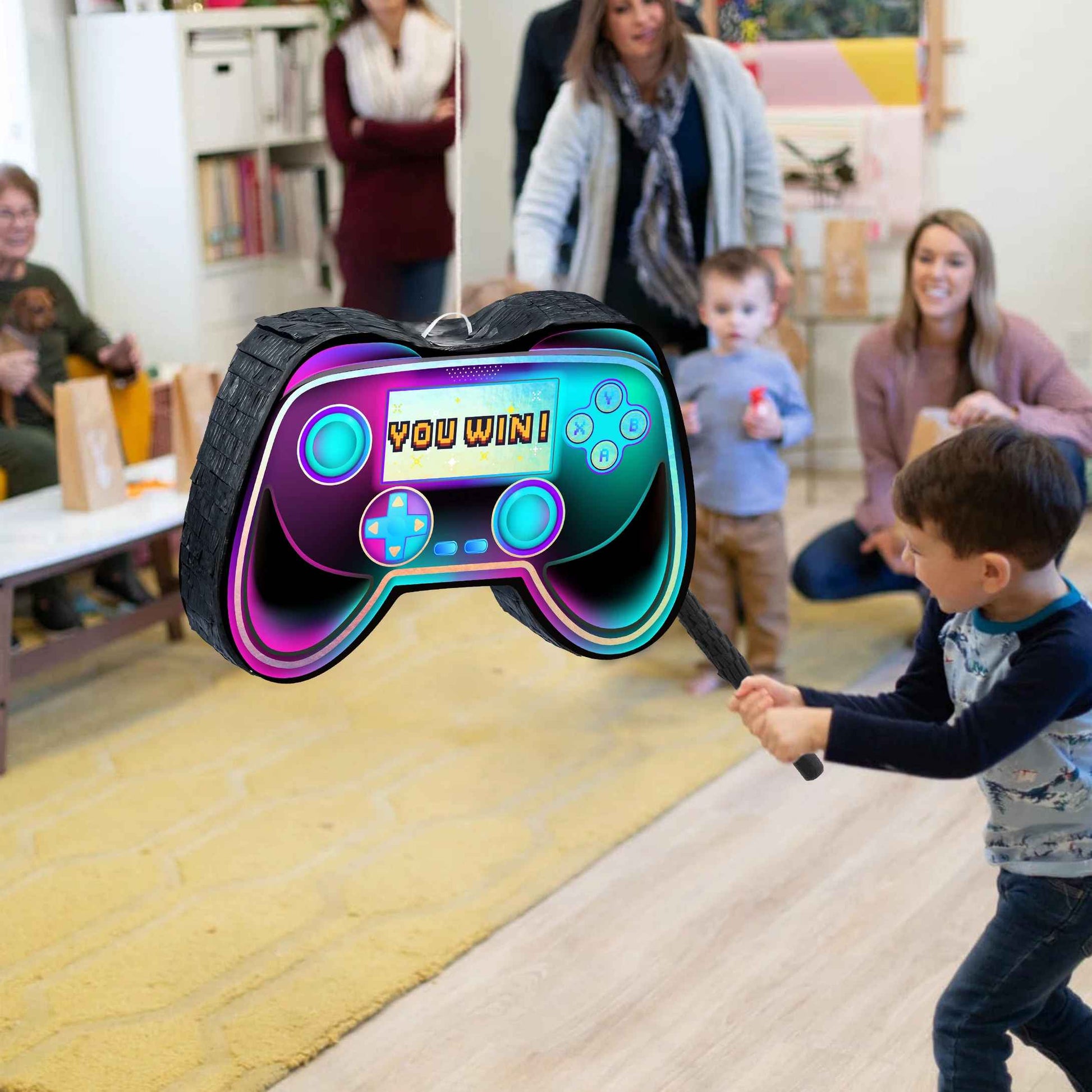 pinata manette jeux video garcon frappe